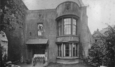 An old black and white photo taken outside the front of Blackfriars Priory.