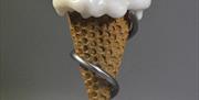 Stone sculpture of an ice cream cone titled 'Before it melts' by Deborah Harrison